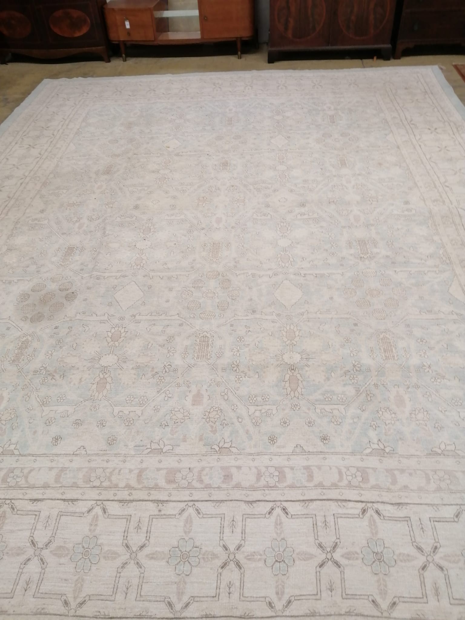 A modern North West Persian design aquamarine and ivory ground carpet, 480 x 370cm